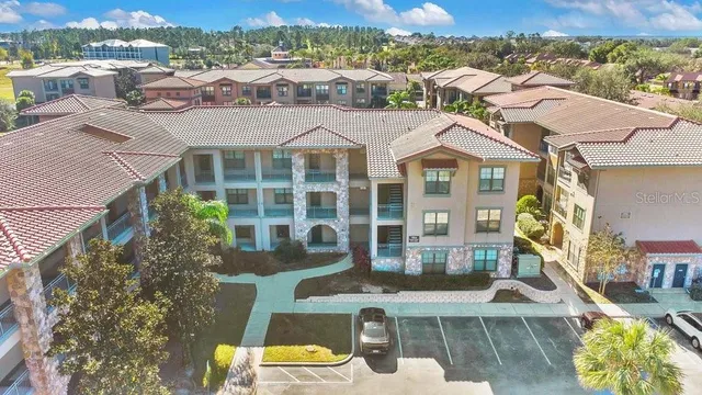 an aerial view of a house with a swimming pool