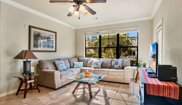 a living room with furniture and a large window