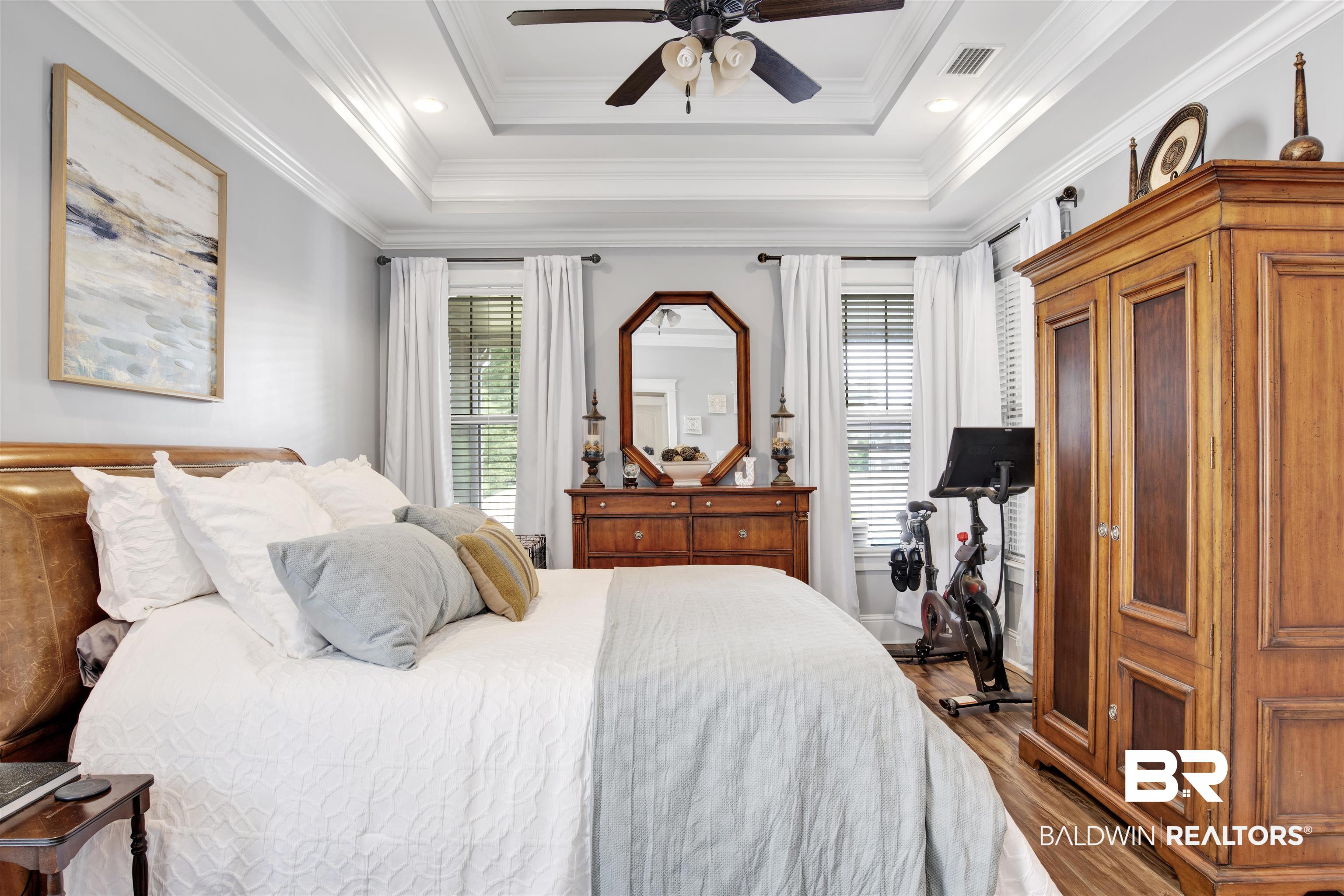 12418 Cambron Trail Daphne, AL 36527 - Photo 34 of 44 Bedroom featuring multiple windows, ceiling fan, and crown molding