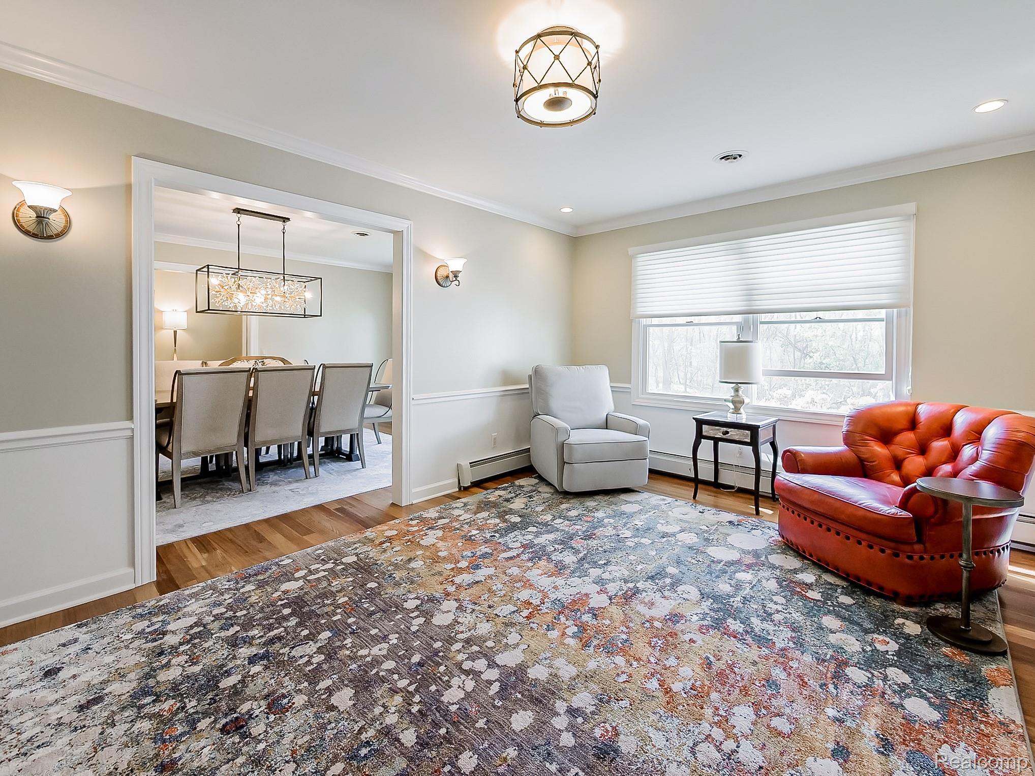 3720 East Clarkston Road Oakland, MI 48363 - Photo 12 of 60 Sitting room featuring light wood-type flooring, ornamental molding, and a baseboard radiator