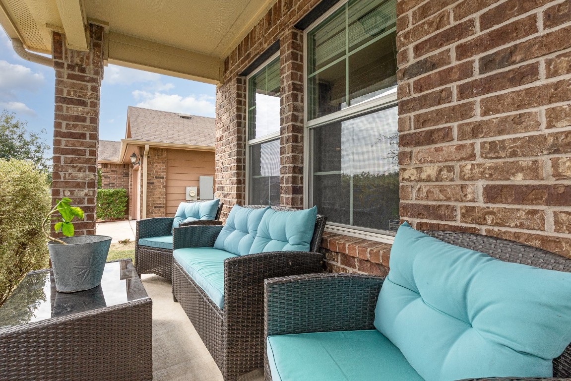 13708 Sierra Wind Lane Elgin, TX 78621 - Photo 2 of 19 Nice front porch and one of the few in the neighborhood.
