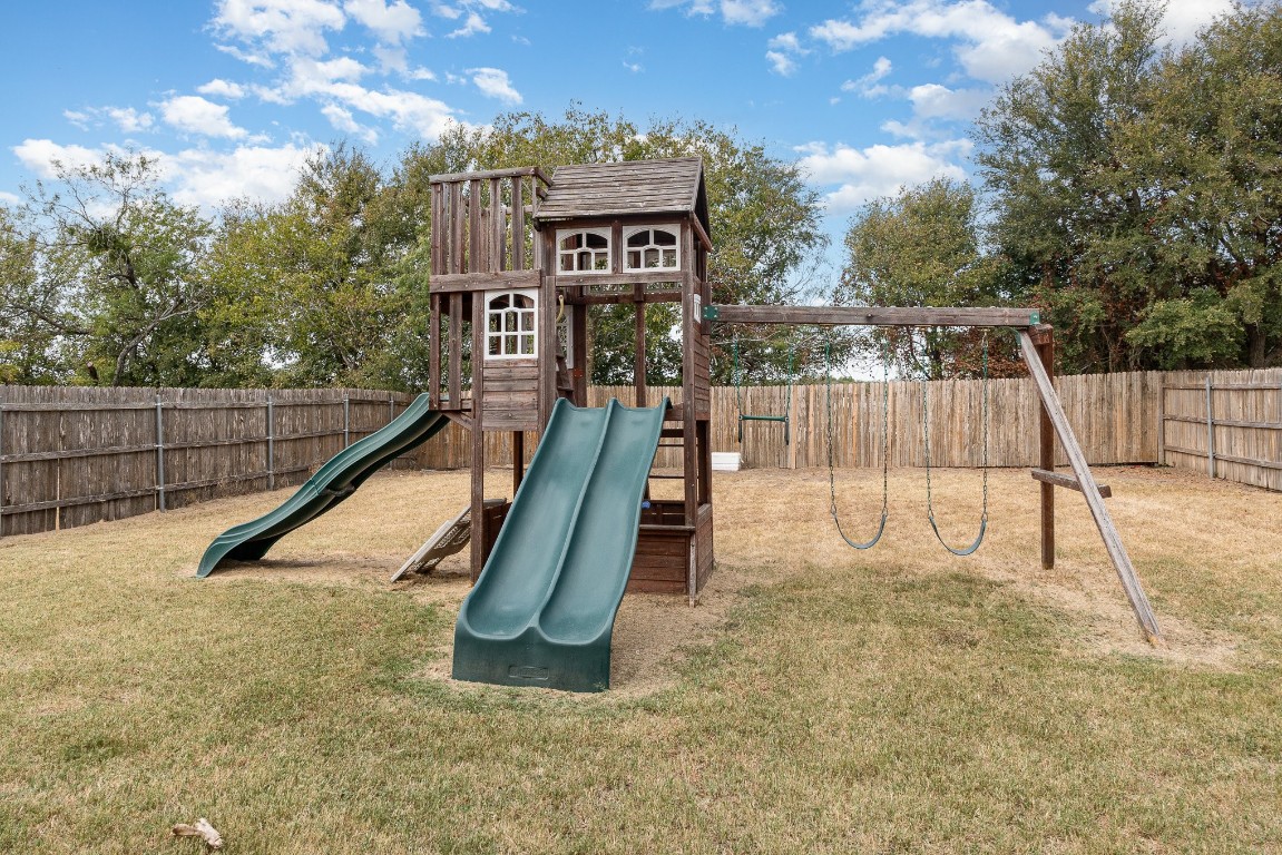 13708 Sierra Wind Lane Elgin, TX 78621 - Photo 4 of 19 Backyard Playscape stays!