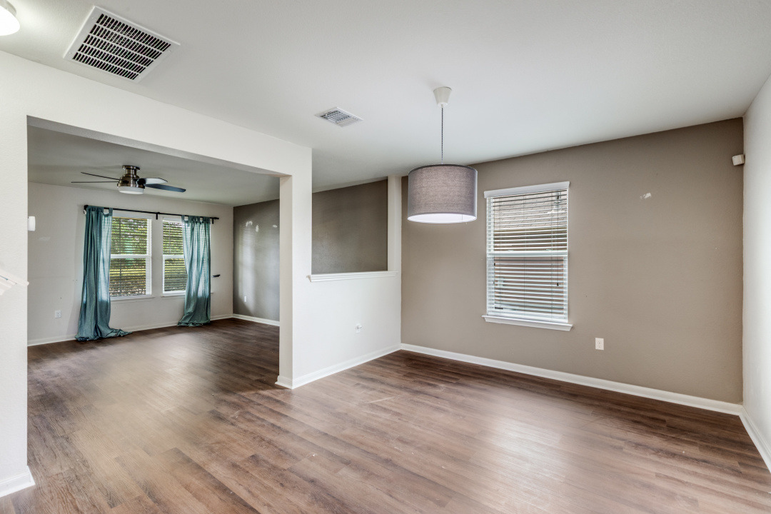 13708 Sierra Wind Lane Elgin, TX 78621 - Photo 8 of 19 Dining room featuring wood finished floors and ceiling fan
