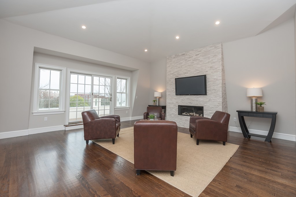 33 Winthrop Road, Unit 1 Brookline, MA 02445 - Photo 12 of 19 a living room with fireplace furniture and a flat screen tv