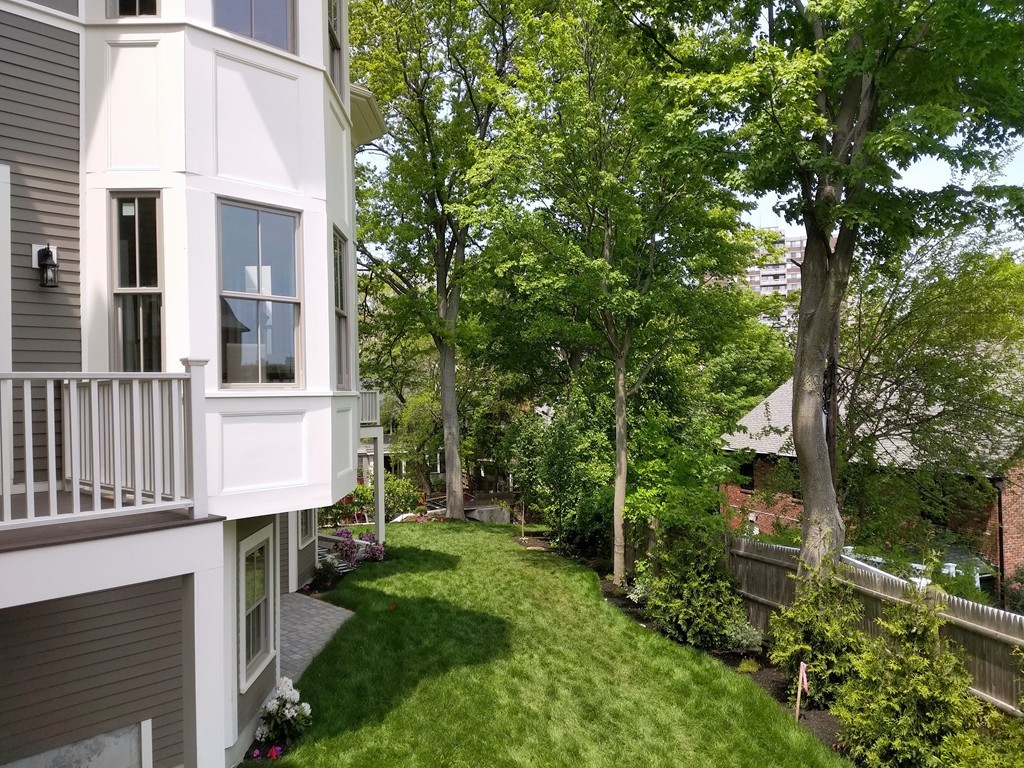 33 Winthrop Road, Unit 1 Brookline, MA 02445 - Photo 15 of 19 a view of a house with a yard
