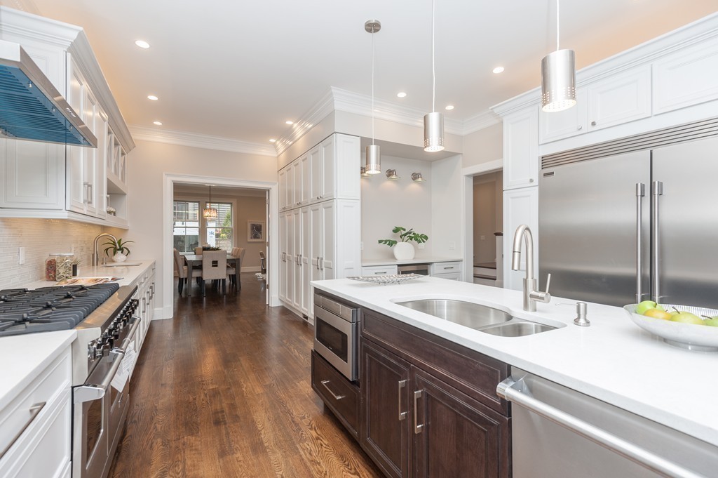33 Winthrop Road, Unit 1 Brookline, MA 02445 - Photo 6 of 19 a kitchen with granite countertop a sink a counter top space stainless steel appliances and cabinets
