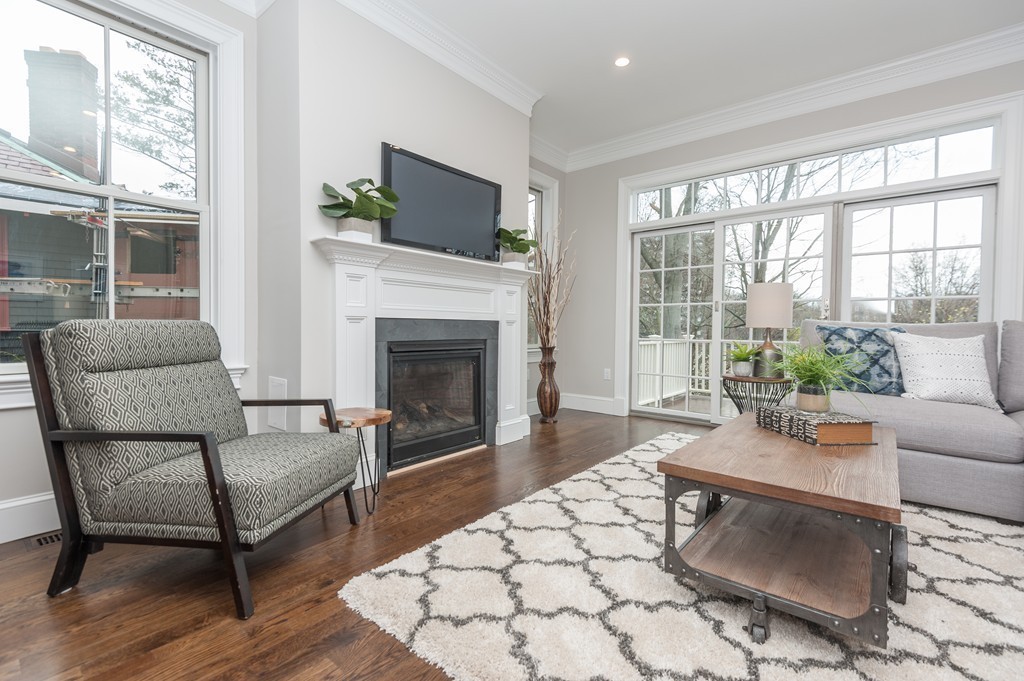 33 Winthrop Road, Unit 1 Brookline, MA 02445 - Photo 7 of 19 a living room with furniture and a fireplace