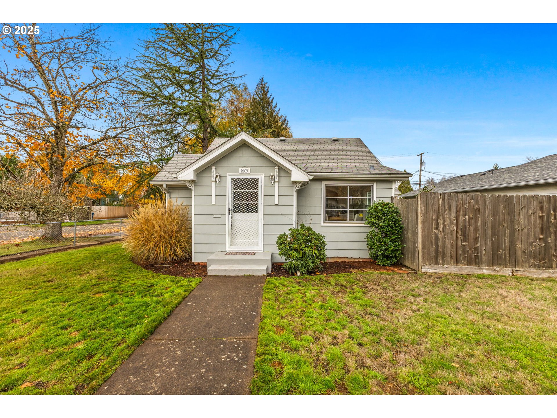 1605 Cottage Street Northeast Salem, OR 97301 - Photo 1 of 23 a front view of a house with garden