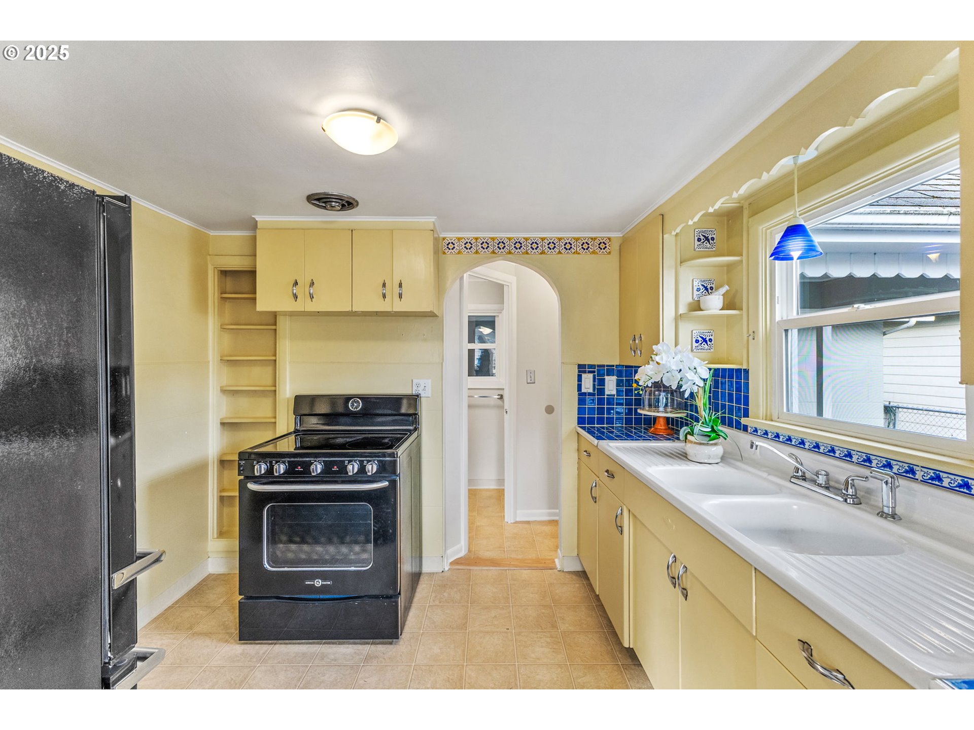 1605 Cottage Street Northeast Salem, OR 97301 - Photo 11 of 23 a kitchen with stainless steel appliances granite countertop a stove a sink and a refrigerator