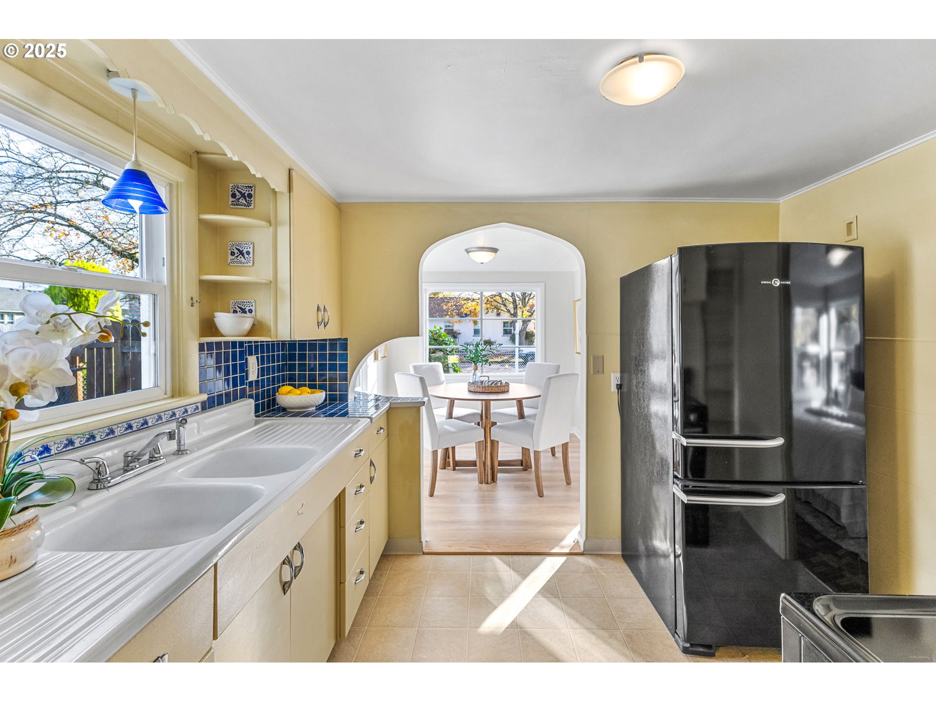 1605 Cottage Street Northeast Salem, OR 97301 - Photo 13 of 23 a kitchen with stainless steel appliances granite countertop a refrigerator and a sink