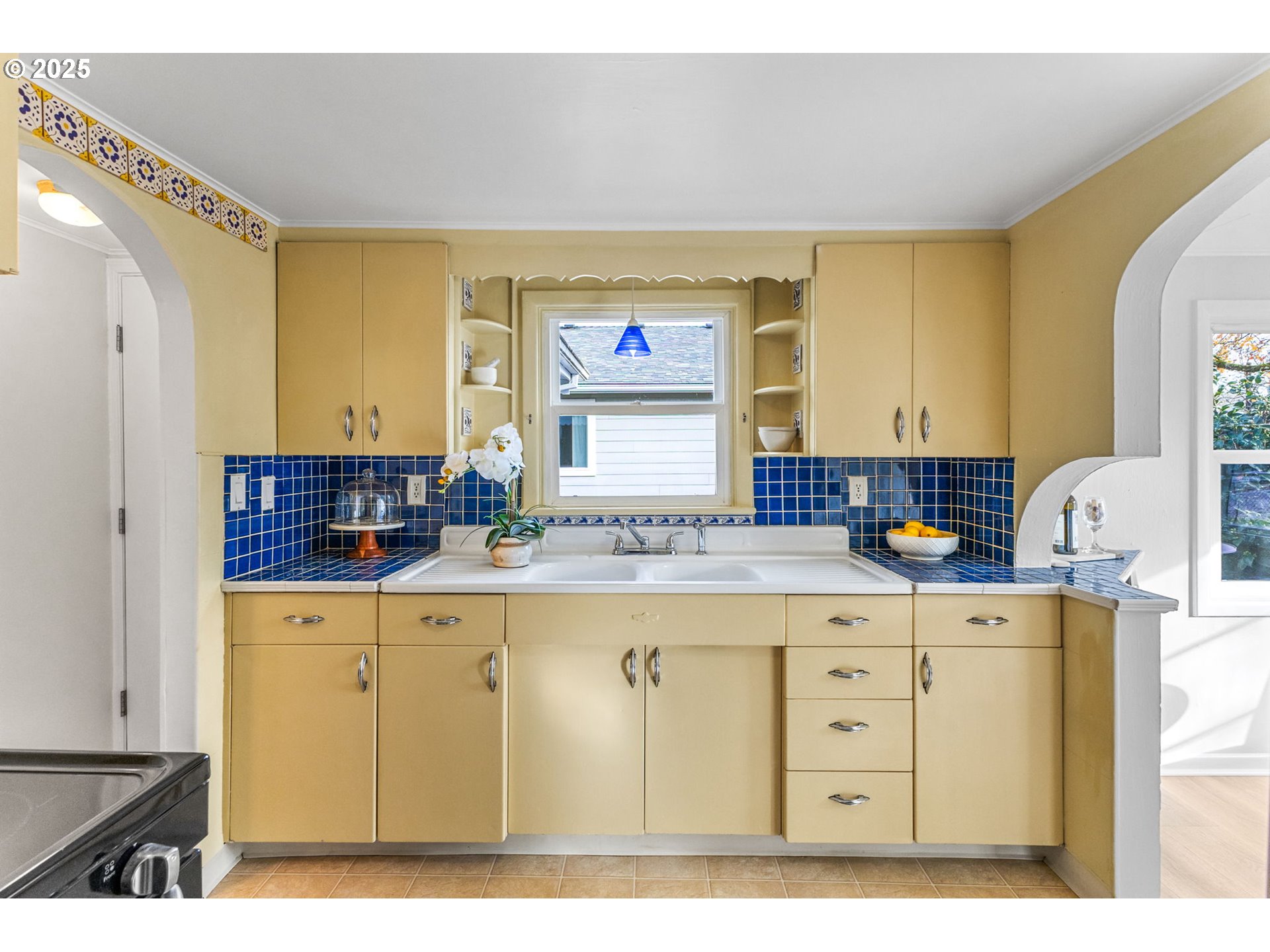 1605 Cottage Street Northeast Salem, OR 97301 - Photo 14 of 23 a kitchen with cabinets a window and a counter space