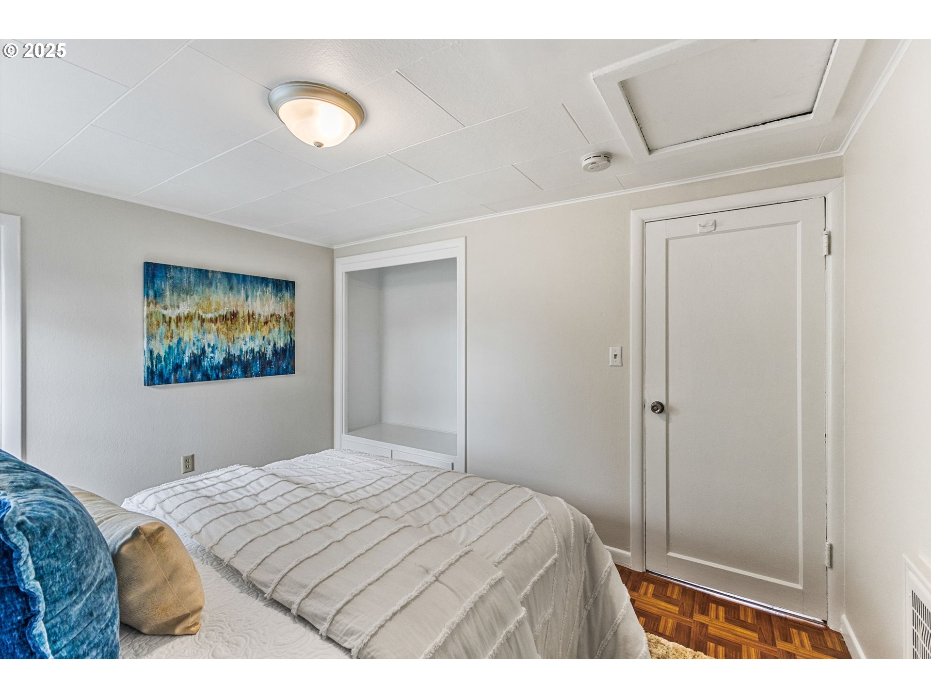 1605 Cottage Street Northeast Salem, OR 97301 - Photo 17 of 23 a bedroom with a bed and a painting on the wall