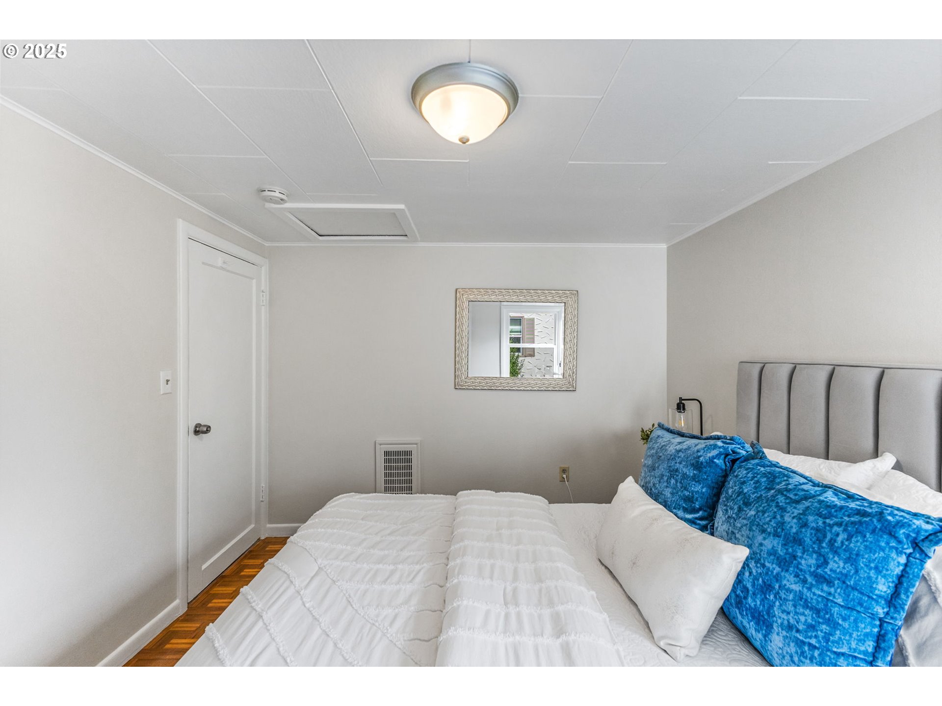 1605 Cottage Street Northeast Salem, OR 97301 - Photo 18 of 23 a bedroom with a bed and a lamp