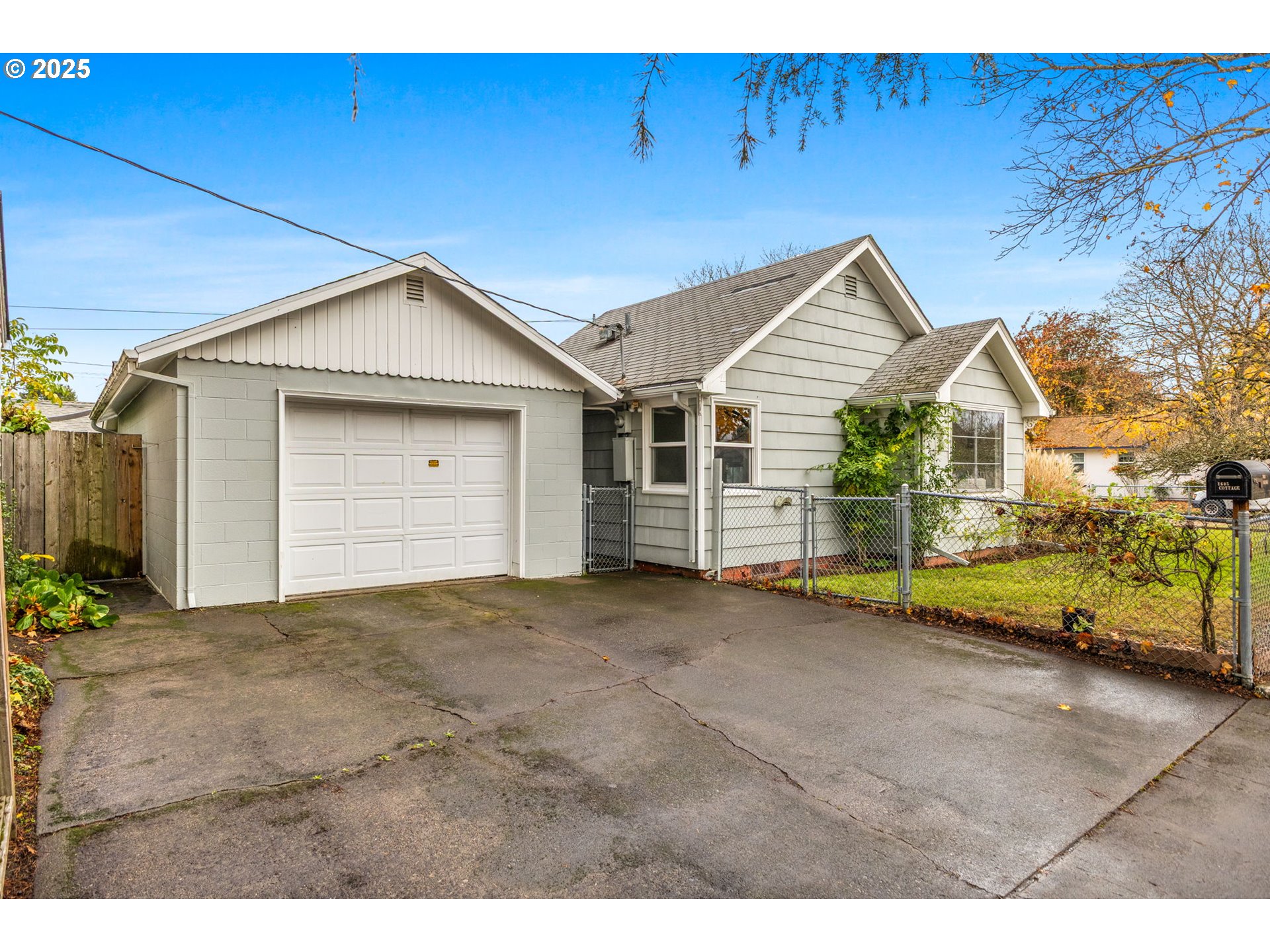 1605 Cottage Street Northeast Salem, OR 97301 - Photo 19 of 23 a view of an house with backyard space and a car parked in garage