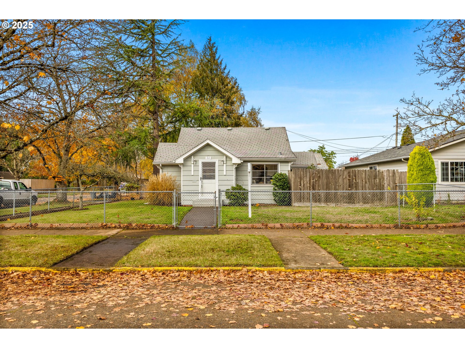 1605 Cottage Street Northeast Salem, OR 97301 - Photo 2 of 23 a view of a white house with a yard