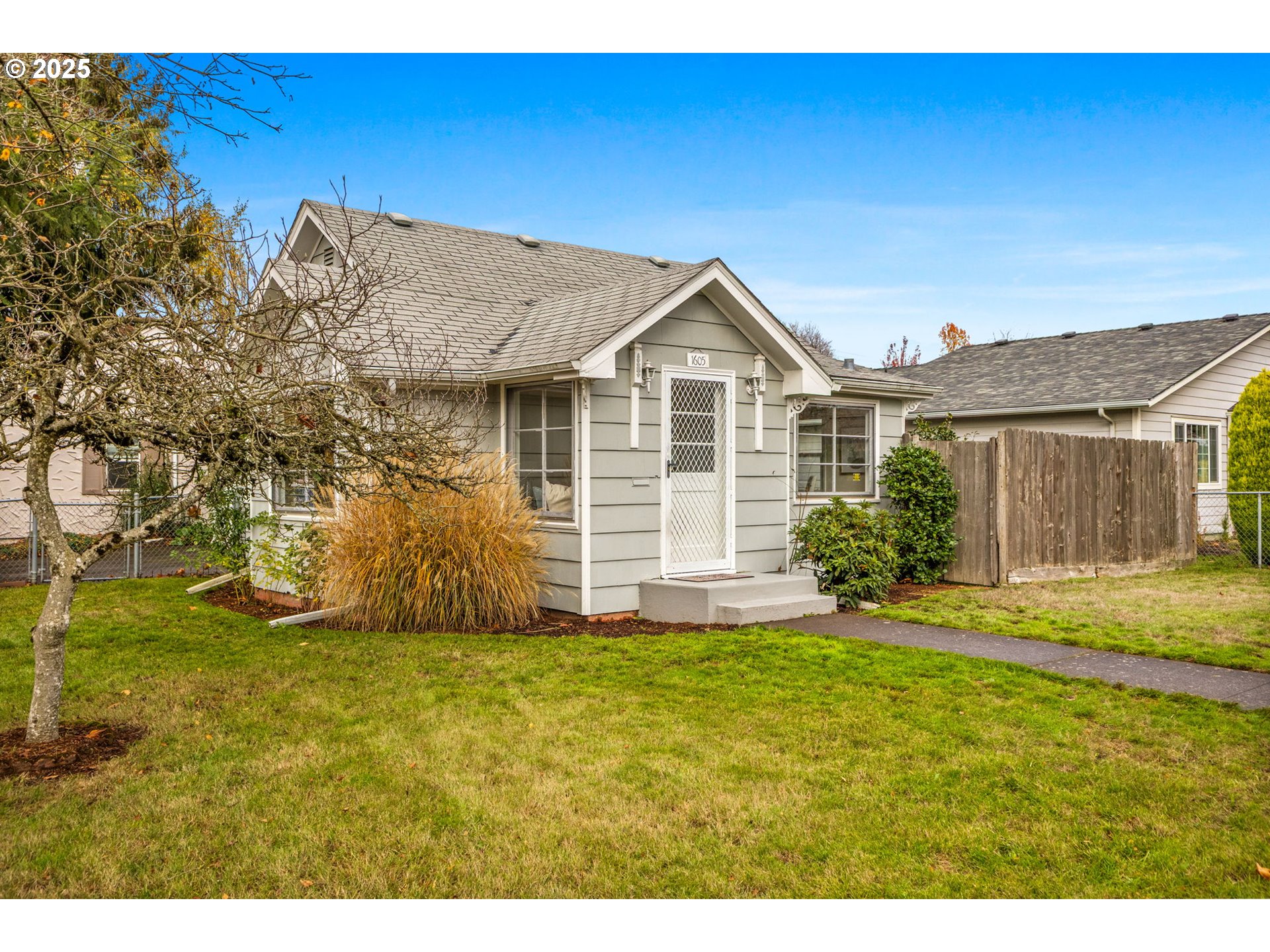 1605 Cottage Street Northeast Salem, OR 97301 - Photo 3 of 23 a front view of a house with a yard