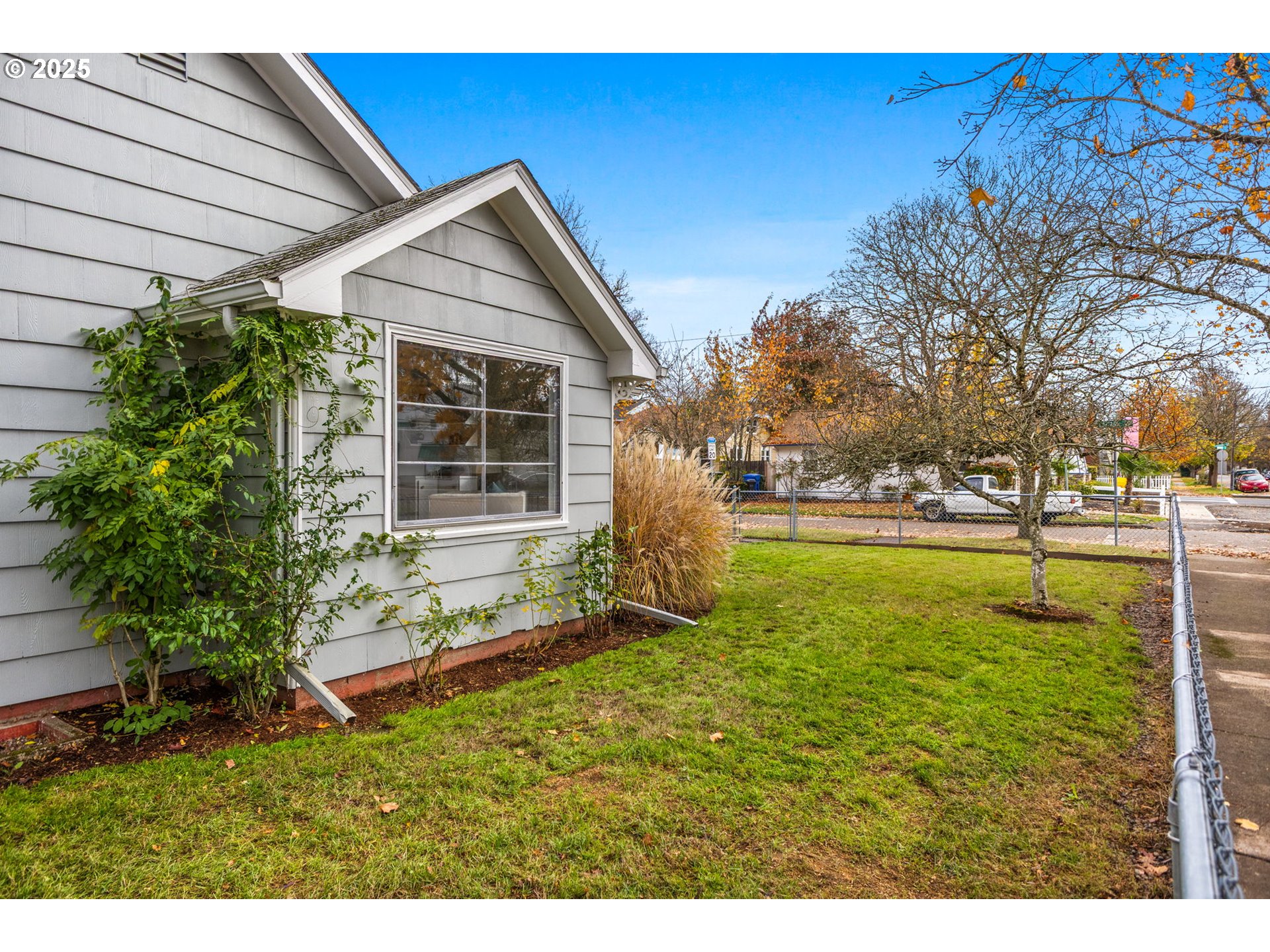 1605 Cottage Street Northeast Salem, OR 97301 - Photo 4 of 23 a backyard of a house with table and chairs