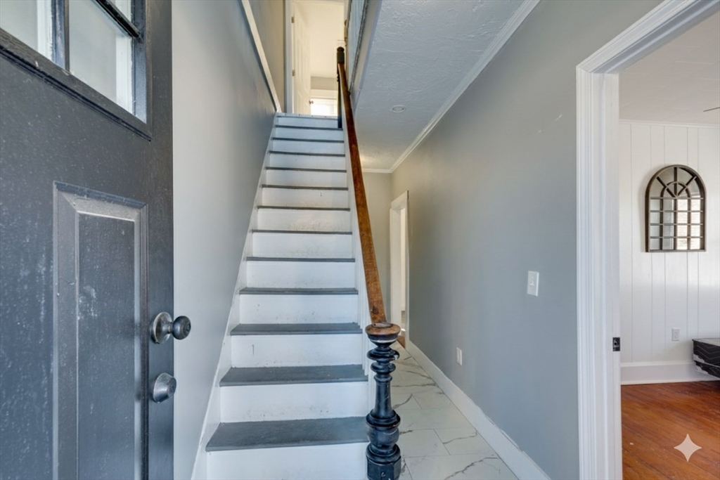 96 Pleasant Street, Unit 96 Ashland, MA 01721 - Photo 12 of 20 a view of entryway with wooden floor and stairs