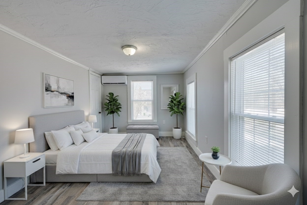 96 Pleasant Street, Unit 96 Ashland, MA 01721 - Photo 13 of 20 a spacious bedroom with a bed and a couch