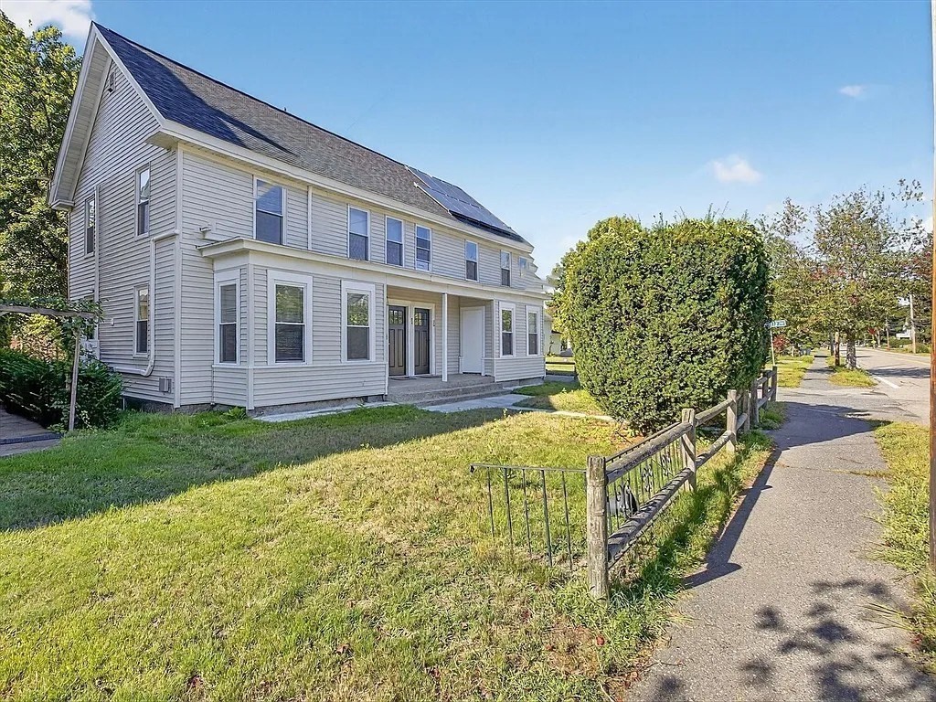 96 Pleasant Street, Unit 96 Ashland, MA 01721 - Photo 18 of 20 a view of a house with brick walls