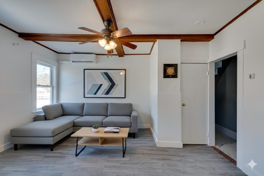 96 Pleasant Street, Unit 96 Ashland, MA 01721 - Photo 5 of 20 a living room with furniture and a ceiling fan