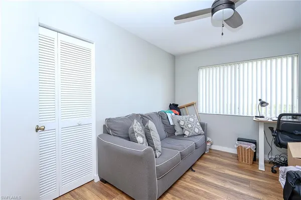 a living room with furniture and a window