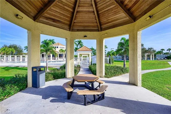 a patio with table and chairs