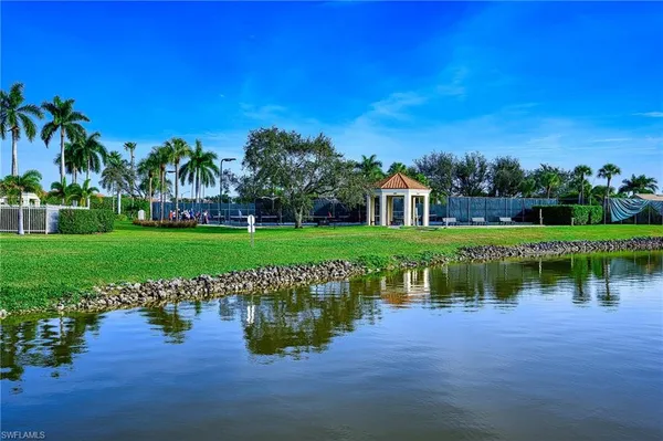 a view of a lake with a house in the background