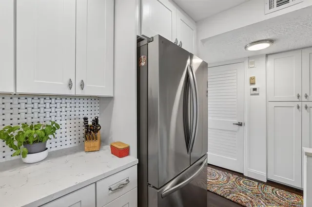 a kitchen with a sink stove and microwave