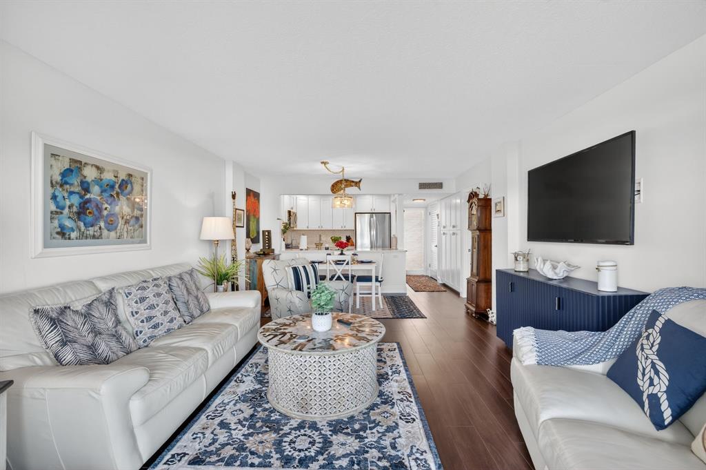 2611 North Riverside Drive, Unit 304 Pompano Beach, FL 33062 - Photo 21 of 61 a living room with furniture and a flat screen tv
