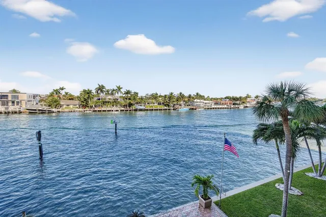 a kitchen that has a lot of cabinets a sink and a refrigerator