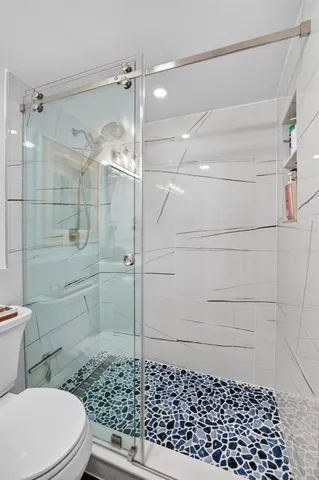 a view of a swimming pool with a lounge chairs