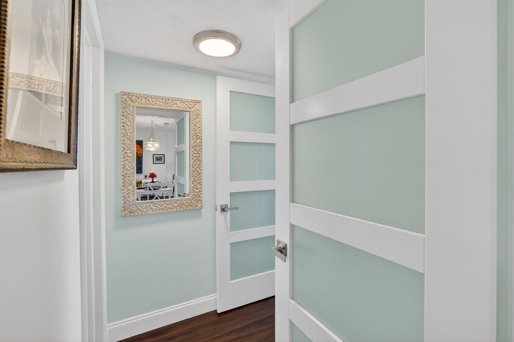 2611 North Riverside Drive, Unit 304 Pompano Beach, FL 33062 - Photo 40 of 61 a view of a hallway with wooden floor