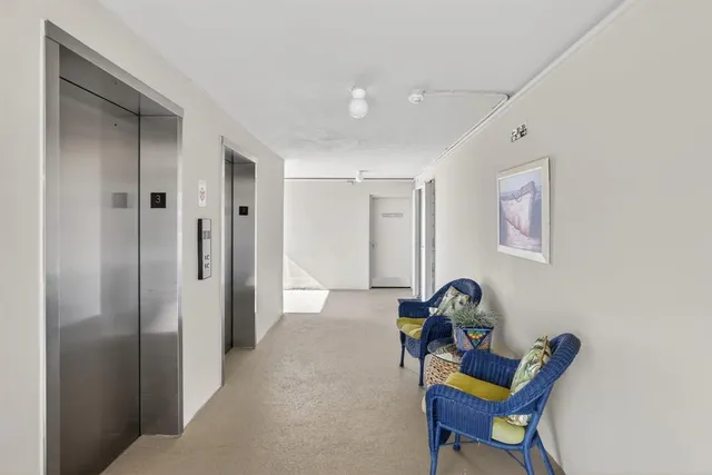 a view of living room with furniture and a window