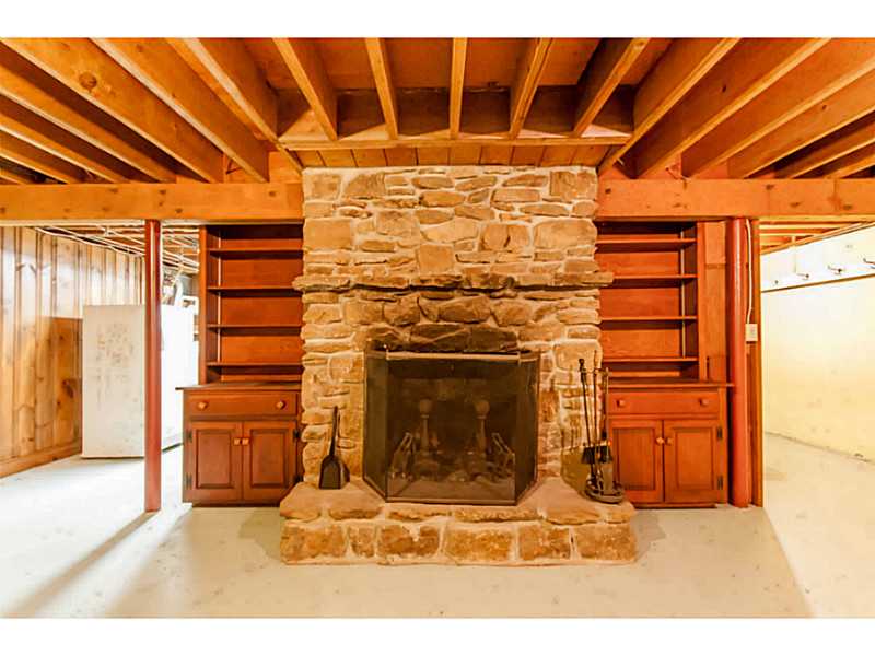 25 Plateau Road Westerly, RI 02891 - Photo 23 of 25 Cellar or Basement. built-ins & fireplace, even in the basement