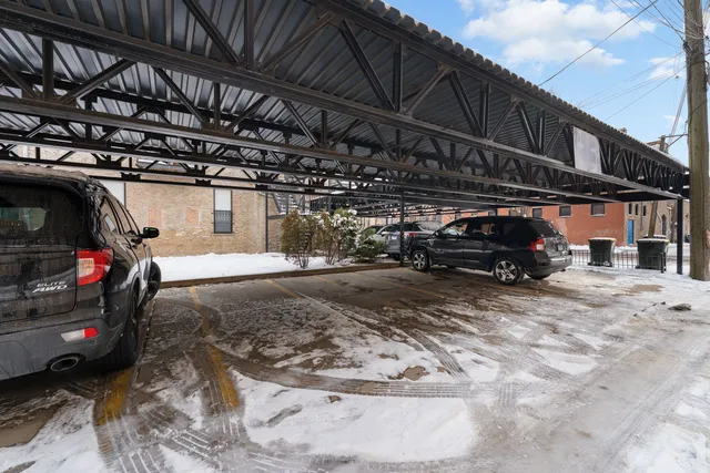 an aerial view of a building with parking space