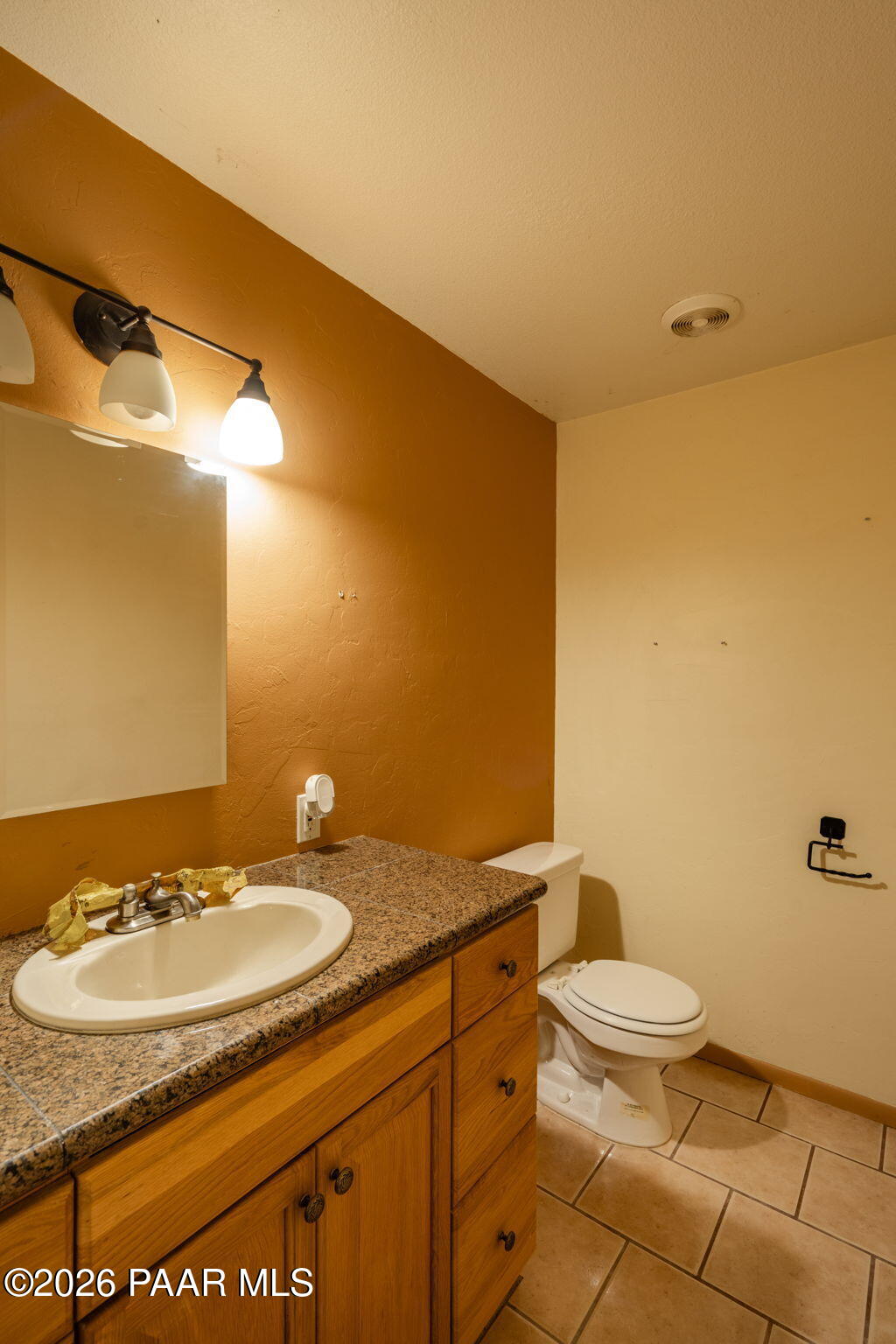 1710 Grandview Road Prescott, AZ 86305 - Photo 22 of 47 a bathroom with a granite countertop sink and a mirror