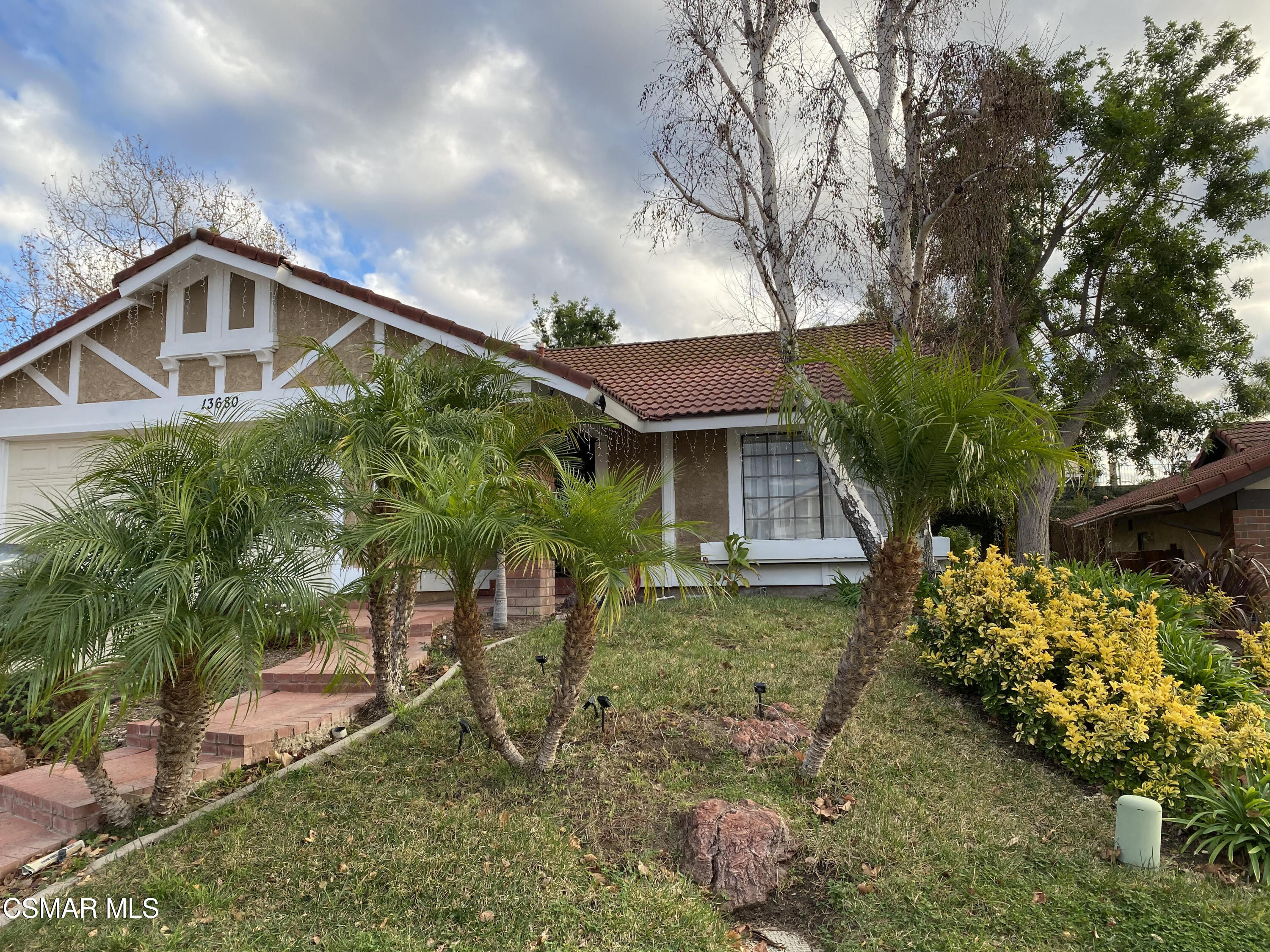 13680 Bear Valley Road Moorpark, CA 93021 - Photo 1 of 50 a front view of a house with a yard