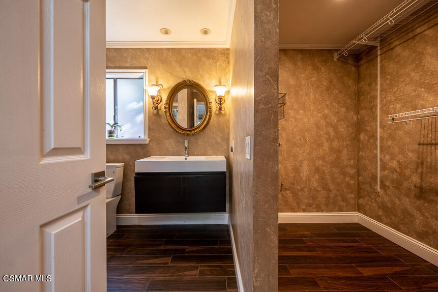 13680 Bear Valley Road Moorpark, CA 93021 - Photo 22 of 50 a bathroom with a sink and a mirror