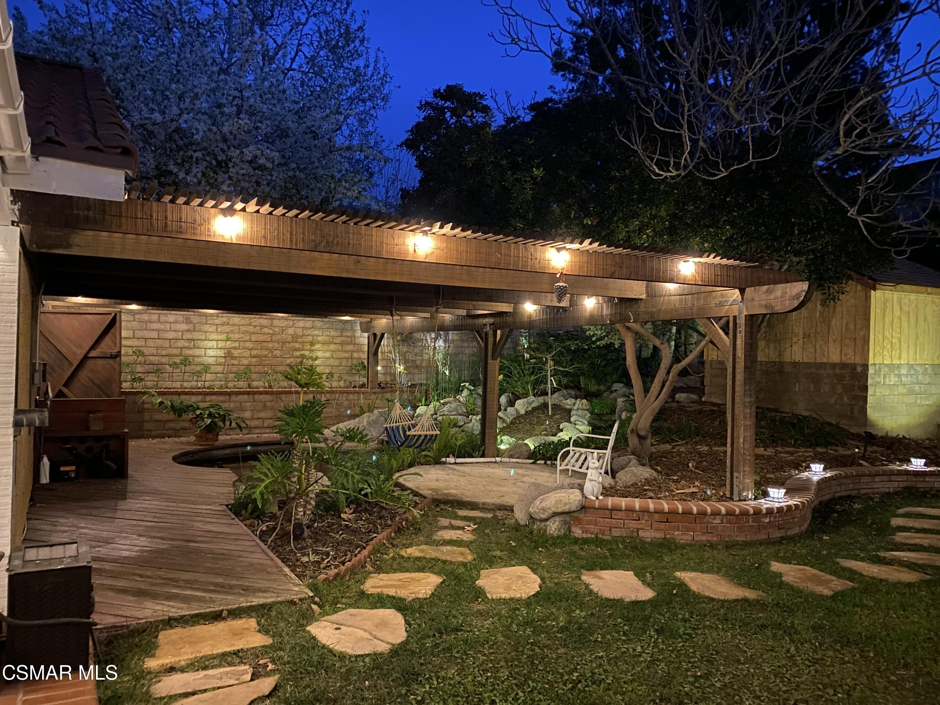 13680 Bear Valley Road Moorpark, CA 93021 - Photo 45 of 50 a view of a swimming pool with an outdoor seating and a yard