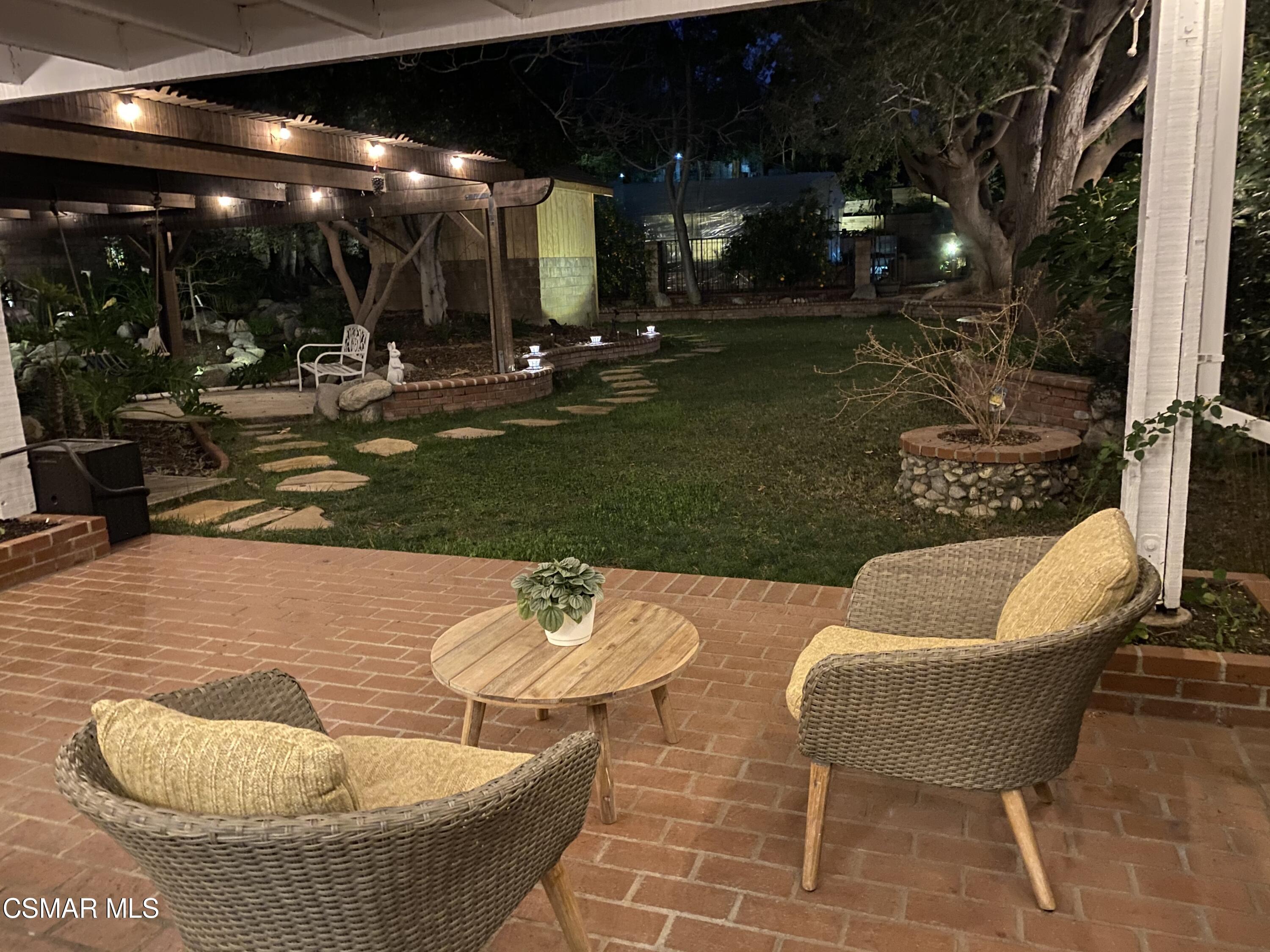 13680 Bear Valley Road Moorpark, CA 93021 - Photo 50 of 50 a view of a patio with swimming pool and sitting area