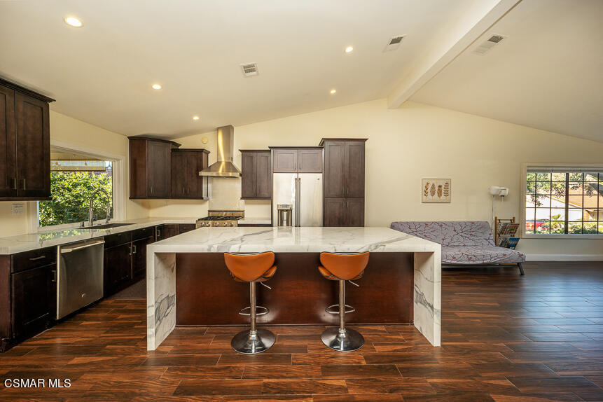 13680 Bear Valley Road Moorpark, CA 93021 - Photo 5 of 50 a kitchen with stainless steel appliances granite countertop a sink counter space and living room