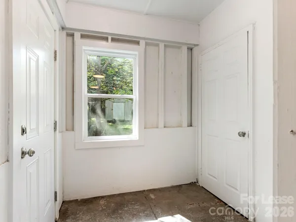 a view of a backyard with large trees