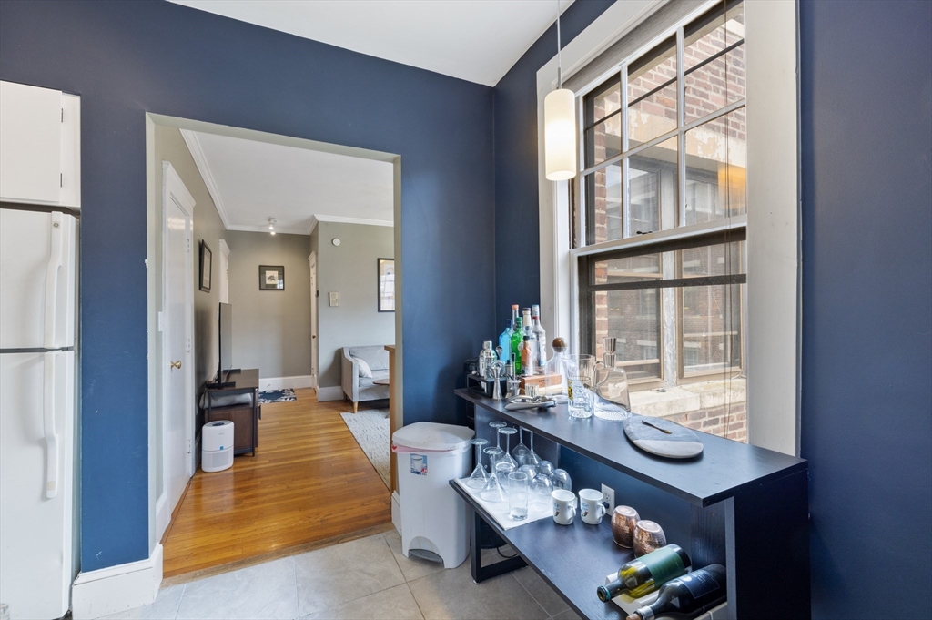 120 Sutherland Road, Unit 7 Boston, MA 02135 - Photo 13 of 25 a living room with furniture and a window