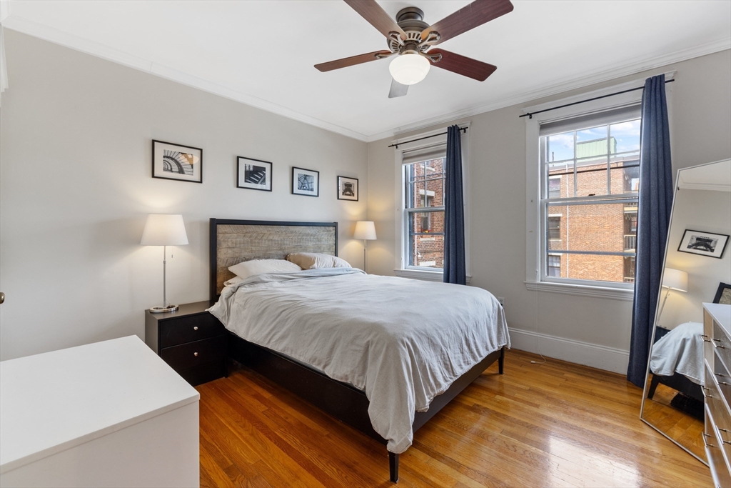 120 Sutherland Road, Unit 7 Boston, MA 02135 - Photo 14 of 25 a bedroom with a large bed and a window