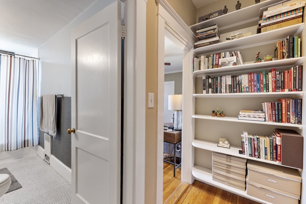 120 Sutherland Road, Unit 7 Boston, MA 02135 - Photo 17 of 25 a view of a livingroom with shelves