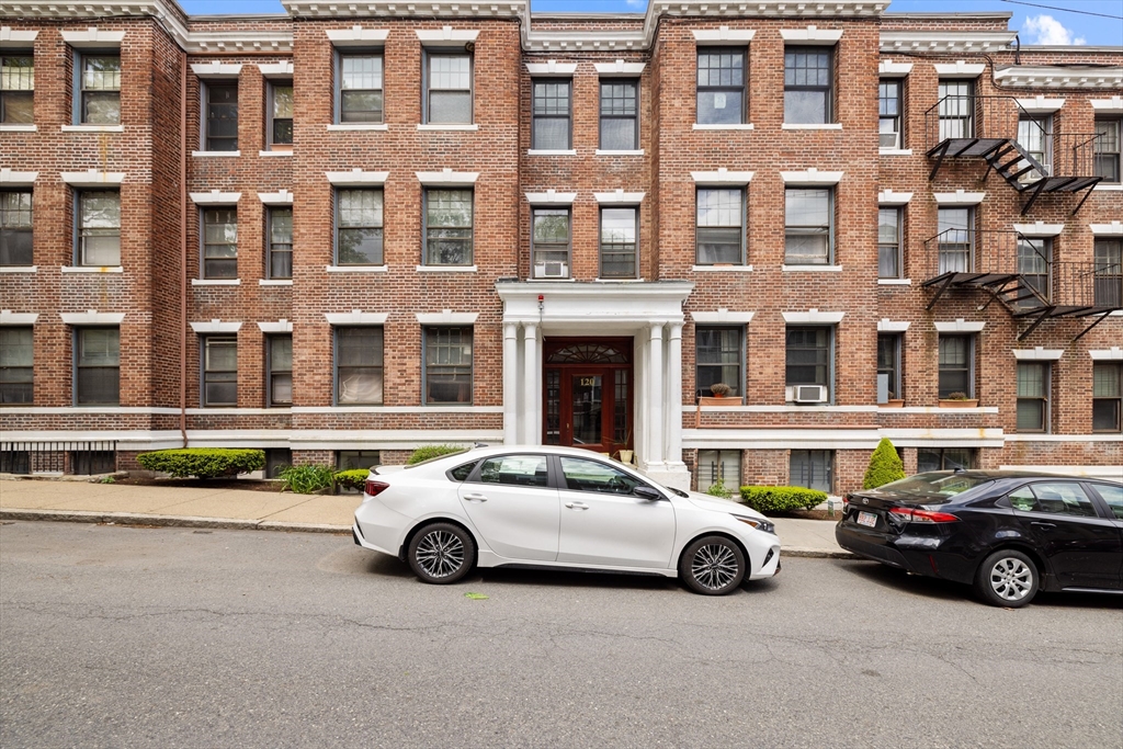 120 Sutherland Road, Unit 7 Boston, MA 02135 - Photo 24 of 25 a car parked in front of a building