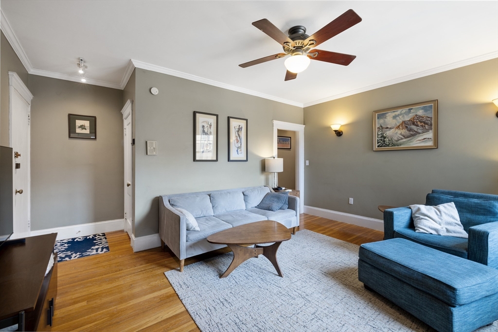 120 Sutherland Road, Unit 7 Boston, MA 02135 - Photo 5 of 25 a living room with furniture and a rug