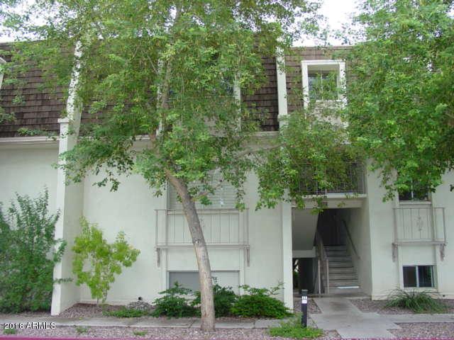 1018 East Osborn Road, Unit B Phoenix, AZ 85014 - Photo 4 of 7 a front view of a house with a tree