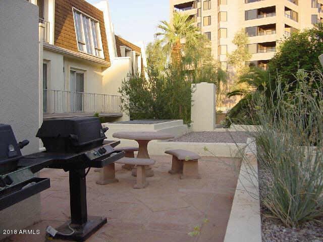 1018 East Osborn Road, Unit B Phoenix, AZ 85014 - Photo 6 of 7 a view of a patio with couches and potted plants